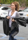 Miley Cyrus In white tshirt and skinny tight jeans at a Hospital in Los Angeles